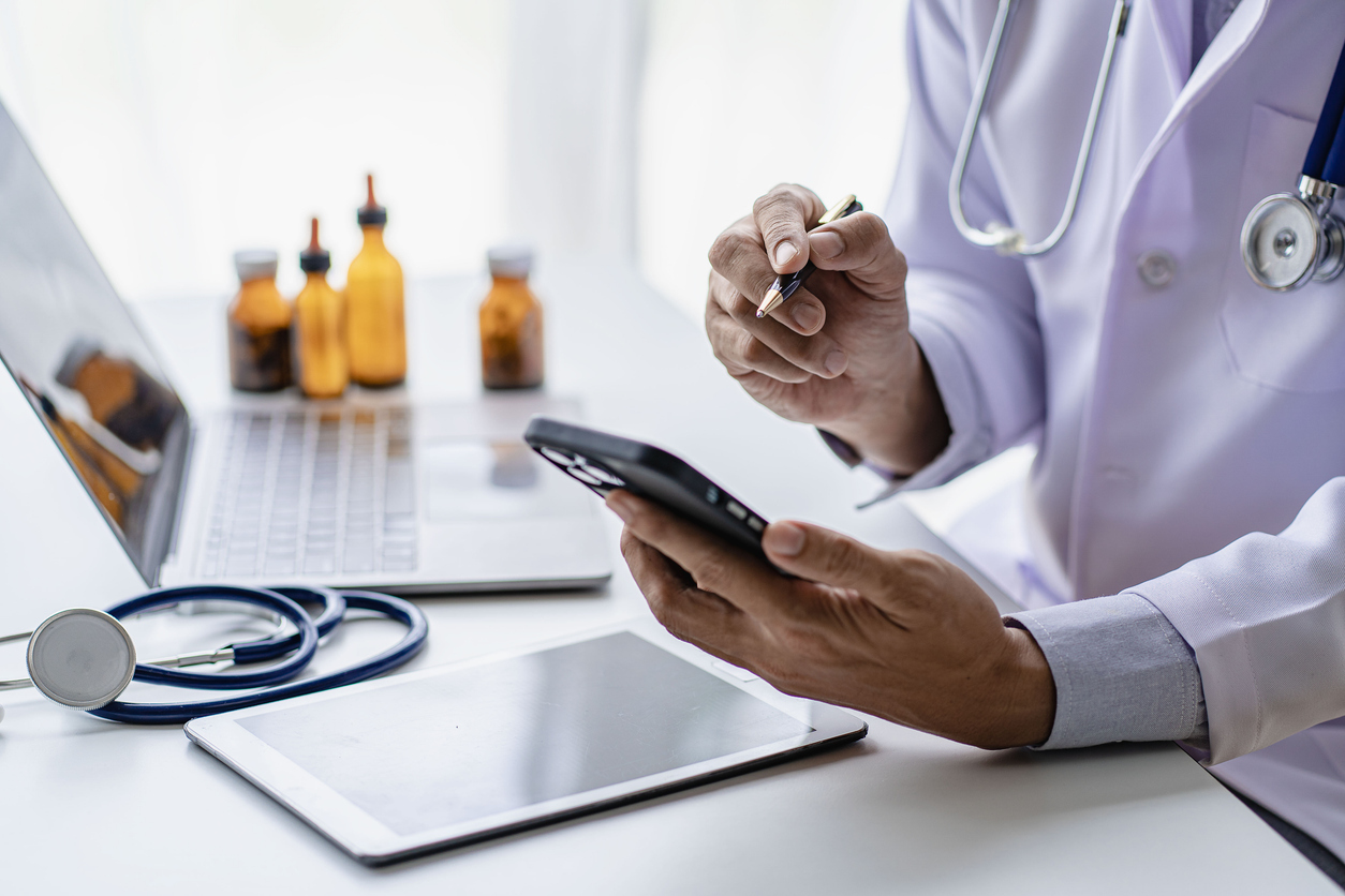Doctor hand using mobile healthcare technology app to consult patient online remotely in software, female therapist holding smartphone